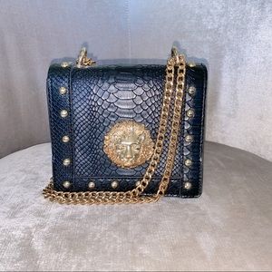 Lion Emblem cross body bag for sale